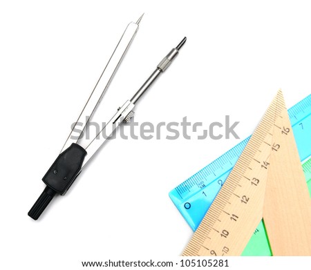 Compasses and rulers. On a white background.