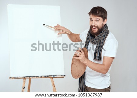 artist with a brush and a palette                          