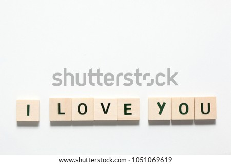 words i love you  made of wooden block isolated on white background
