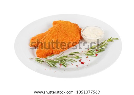 Schnitzel is cut into pieces of chicken, pork, meat, grilled, barbecued, with red pepper and rosemary isolated white background. Tartar, sour cream, mayonnaise sauce. For the menu Side view Royalty-Free Stock Photo #1051077569
