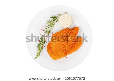 Schnitzel is cut into pieces of chicken, pork, meat, grilled, barbecued, with red pepper and rosemary isolated white background. Tartar, sour cream, mayonnaise sauce. For the menu View from above Royalty-Free Stock Photo #1051077572