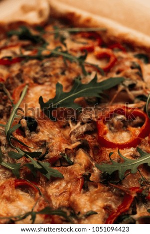 Delicious pizza with cheese, ruccola and olives, traditional Italian cuisine