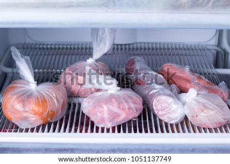 Sausages in a bag in the fridge. Frozen food