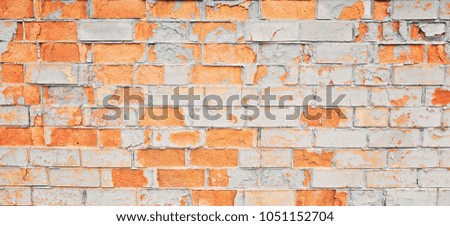 Vintage old painted distressed grungy brick wall surface.