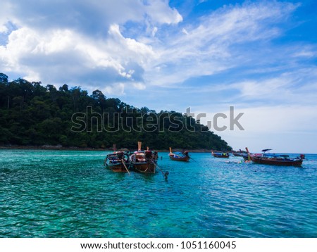 Tranquil blue sea with exotic island Andaman sea, Thailand