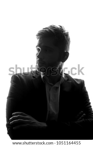 Silhouette of caucasian man in suit.