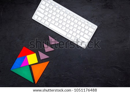 jigsaw puzzle game piece on office table in business strategy set on dark background top view mock up