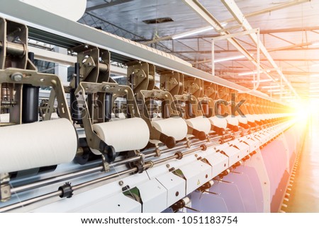 Coarse cotton factory in spinning production line and a rotating machinery and equipment production company Royalty-Free Stock Photo #1051183754