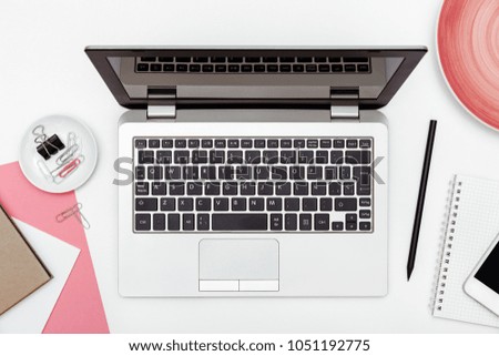 Feminine business desk from above on white background. Flat lay