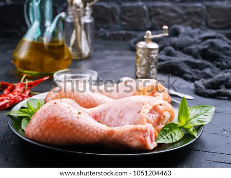 Raw meat, chicken legs, chicken with herbs and spices 