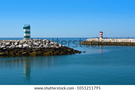 Two lighthouses at the entrance of fishing port