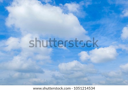 white fluffy clouds in the blue sky background