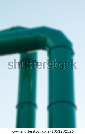 A large factory for the production of gasoline. Abstract background