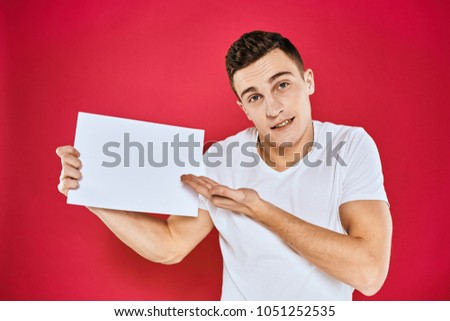  white sheet of paper, man with a beard, logo                              