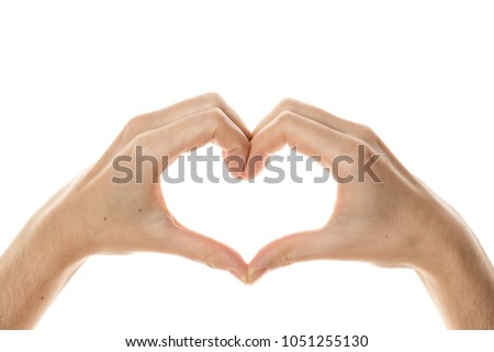 Shape of the heart made by female hands isolated on white Royalty-Free Stock Photo #1051255130