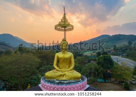 aerial photography the golden buddha statue at wat Sirattanan Mongkol near Mae Kajan Hot Spring
 Wiang Pa Pao Chiang Rai Thailand.