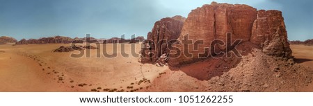Aerial view of the gigantic rocks and mountains in the nature reserve of Wadi Rum, high resolution panorama, composed of single pictures, made with drone