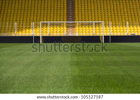 Empty stadium and the goal Royalty-Free Stock Photo #105127187