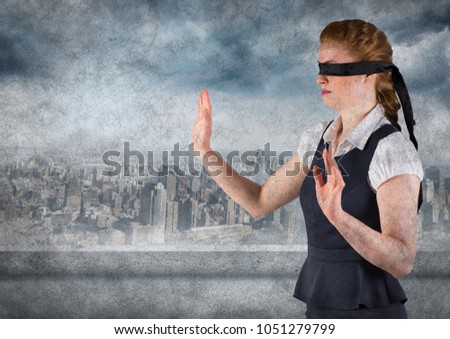 Digital composite of Business woman blindfolded with grunge overlay against skyline with grey clouds