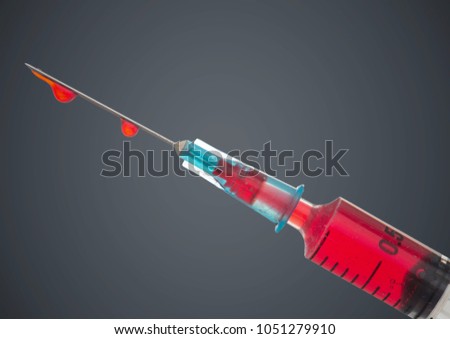 Digital composite of Syringe with red liquid against grey background