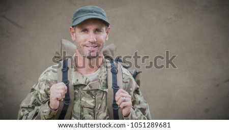 Digital composite of Soldier with backpack against brown background with grunge overlay