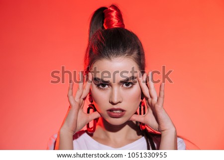 portrait of fashionable woman in looking at camera