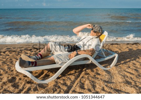 A man - old school photographer on a beach