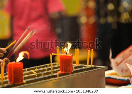 Flame of red candles, Buddhist monks
