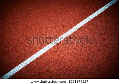 Running track on the stadium with vignetting effect
