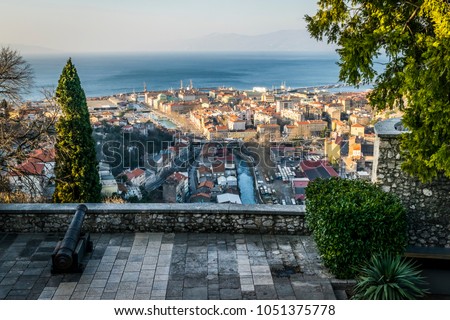 City of Rijeka view from Trsat, Kvarner bay of Croatia.
View from above on the city and harbor of Rijeka, Croatia.

 Royalty-Free Stock Photo #1051375778