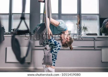 
sports girl. Aerial Yoga. stretching on hammocks.