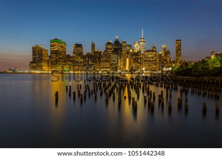Manhattan skyline seen from Brooklyn Bridge Park in New York City. Summer night in NY.