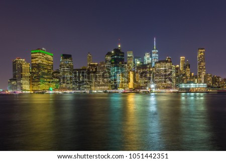 Manhattan skyline seen from Brooklyn Bridge Park in New York City. Summer night in NY.