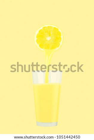 Fresh lemon juice on pastel yellow background