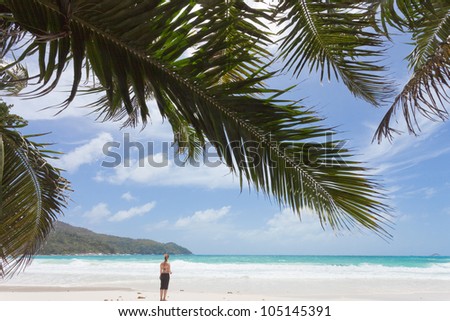 Woman at the famous Anse Lazio, Praslin, Seychelles, Africa
