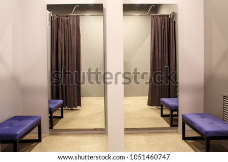 fashion boutique interior, fitting room Royalty-Free Stock Photo #1051460747