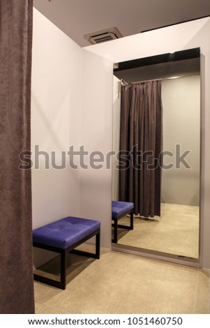 fashion boutique interior, fitting room Royalty-Free Stock Photo #1051460750