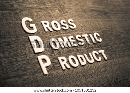 GDP abbreviation with text Gross Domestic Product by wood letters on wood background