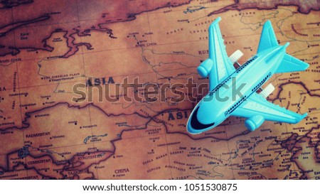Airplane model on Asia part of world map