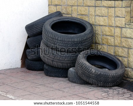 Old tires near the wall