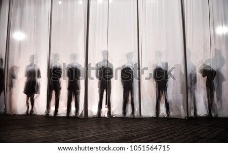 
the silhouette of the men behind the curtain in the theater on stage, the shadow behind the scenes is similar to the white and black piano keys.