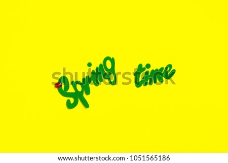 inscription of words spring time yellow background