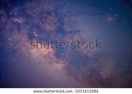 Nebula, the Milky Way, galaxies, and stars shining in the dark sky.