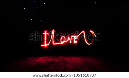 I love you spelt out in night light painting on a long exposure ,fun and romantic