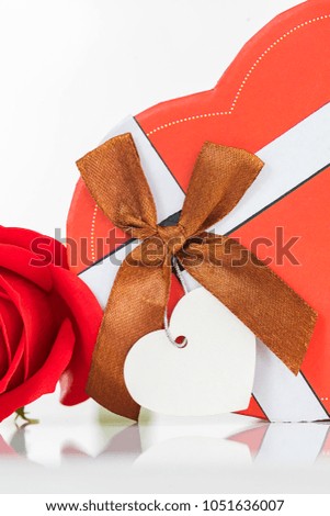 Close up red roses and heart-shaped box ,Valentine's Day concept with roses and red heart-shaped box