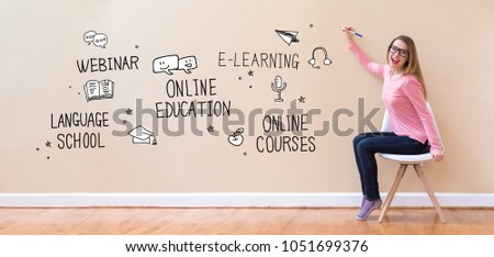 Online Education with young woman holding a pen in a chair