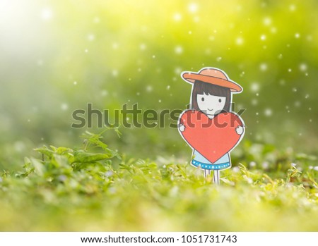 Valentine concept,little girl holding red heart  with snowflake in the nature ,creative design paper cut.