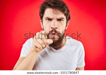  man angry finger pointing at the camera, emotions                               Royalty-Free Stock Photo #1051780847