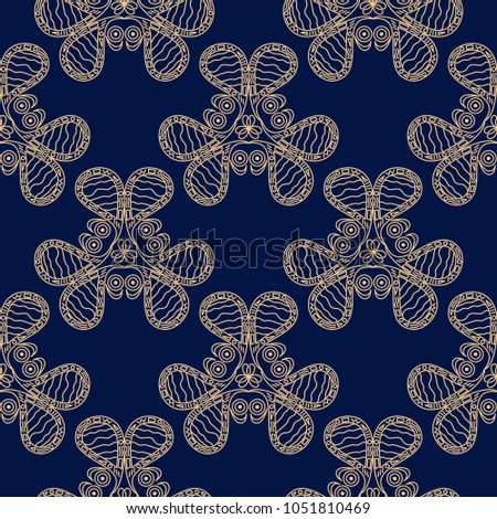 Golden flowers on blue background. Seamless pattern for textile and wallpapers