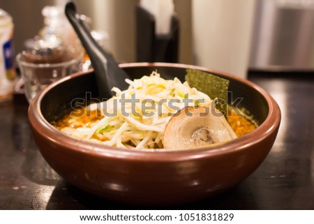 Softy focus on Japanese noodle (Ramen) with pork slide and sprouts
